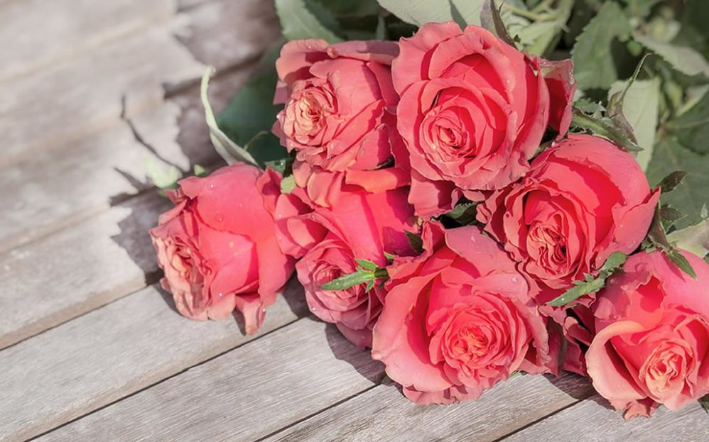 Bouquet of roses on a wooden patio